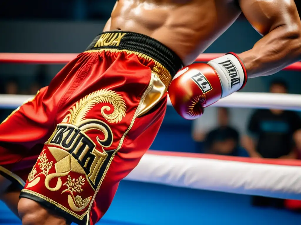 Un luchador ajusta su pantalón rojo y dorado de kickboxing y muay thai, mientras se prepara para el entrenamiento en un ambiente lleno de energía